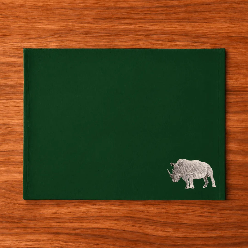 Handmade Rhino Embroidery table mats by Ilisah, set of 4 in white, durable cotton canvas, perfect for dining decor.