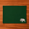 Handmade Rhino Embroidery table mats by Ilisah, set of 4 in white, durable cotton canvas, perfect for dining decor.