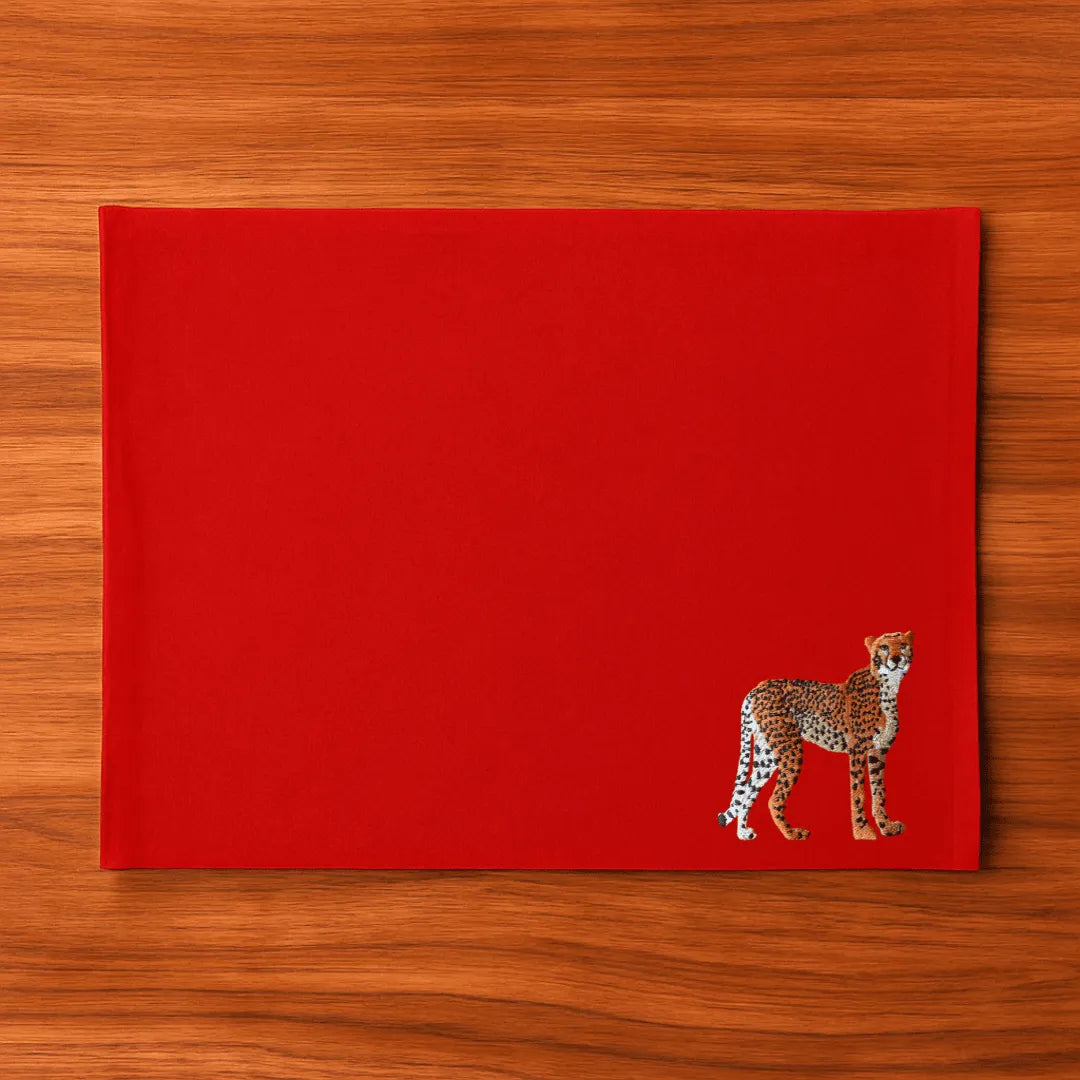 Handmade Ilisah Cheetah Embroidery table mats in Pine Green, set of 4, 100% cotton canvas, perfect for dining decor.