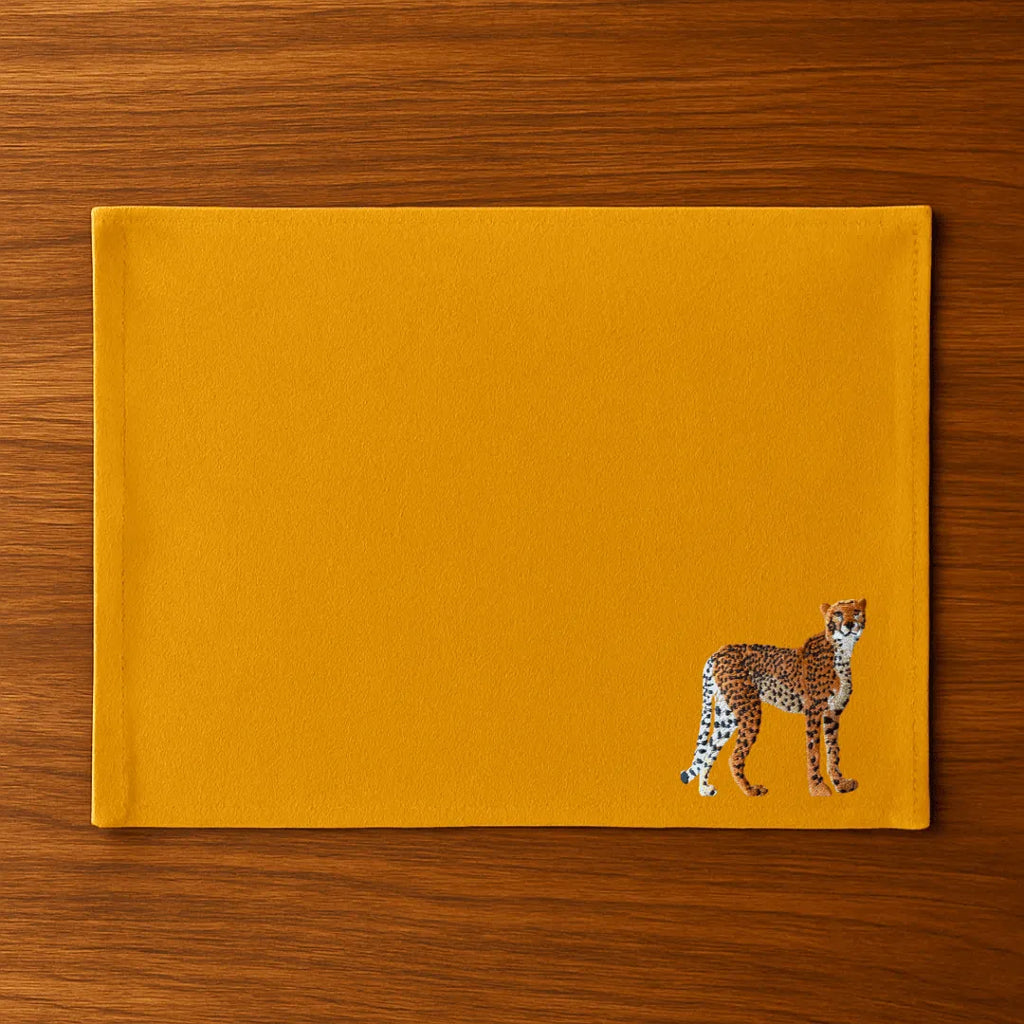 Handmade Ilisah Cheetah Embroidery table mats in Pine Green, set of 4, 100% cotton canvas, perfect for dining decor.