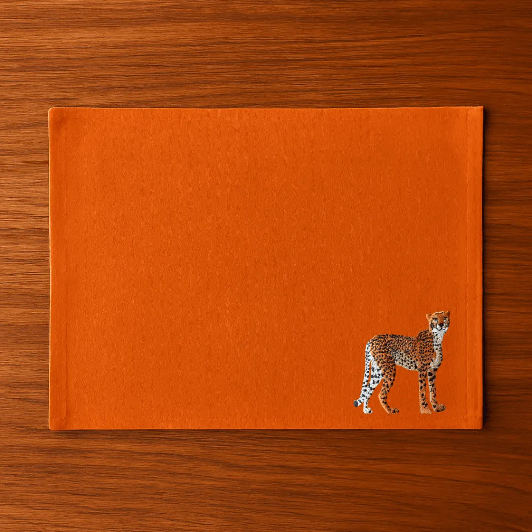 Handmade Ilisah Cheetah Embroidery table mats in Pine Green, set of 4, 100% cotton canvas, perfect for dining decor.