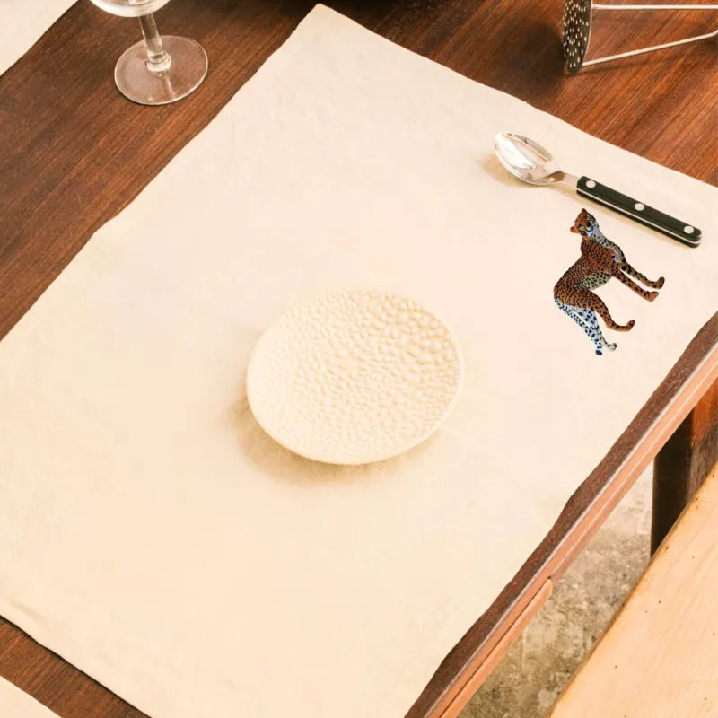 Handmade Ilisah Cheetah Embroidery table mats in Pine Green, set of 4, 100% cotton canvas, perfect for dining decor.