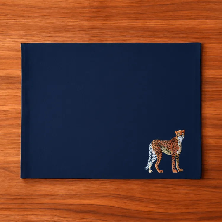 Handmade Ilisah Cheetah Embroidery table mats in Pine Green, set of 4, 100% cotton canvas, perfect for dining decor.