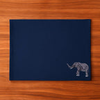 Handmade Ilisah table mats featuring elephant embroidery, available in burnt orange, beige white, or navy blue, set of 4.