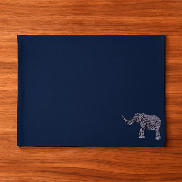 Handmade Ilisah table mats featuring elephant embroidery, available in burnt orange, beige white, or navy blue, set of 4.