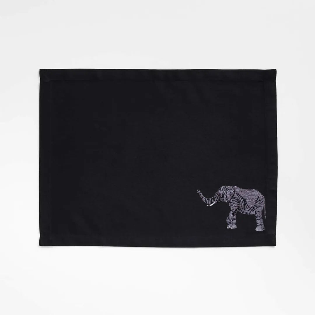 Handmade Ilisah table mats featuring elephant embroidery, available in burnt orange, beige white, or navy blue, set of 4.