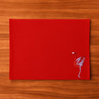 Handmade Ilisah table mats featuring charming flamingo bird embroidery in navy blue, set of 4, perfect for dining decor.