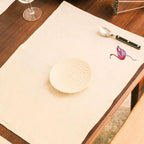 Handmade Ilisah table mats featuring charming flamingo bird embroidery in navy blue, set of 4, perfect for dining decor.