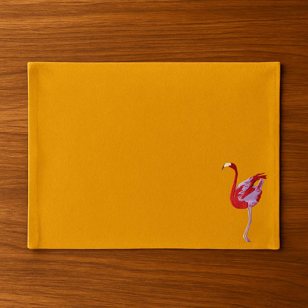 Handmade Ilisah table mats featuring charming flamingo bird embroidery in navy blue, set of 4, perfect for dining decor.