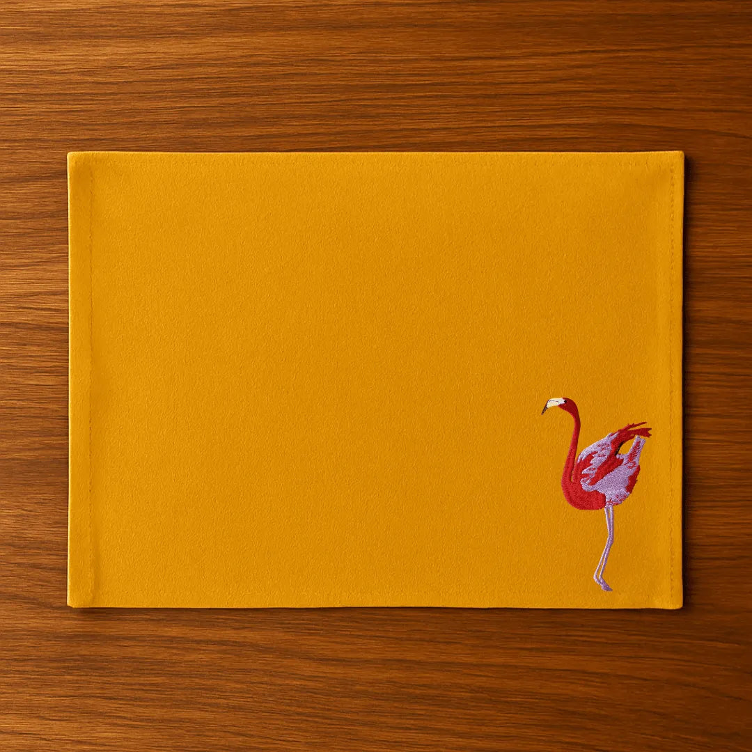 Handmade Ilisah table mats featuring charming flamingo bird embroidery in navy blue, set of 4, perfect for dining decor.