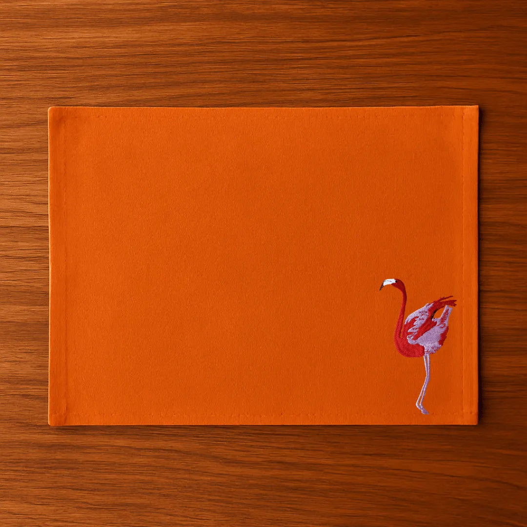 Handmade Ilisah table mats featuring charming flamingo bird embroidery in navy blue, set of 4, perfect for dining decor.