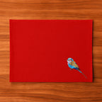 Handmade Ilisah table mats featuring lilac-breasted roller embroidery, set of 4 in mustard, perfect for dining and table d...