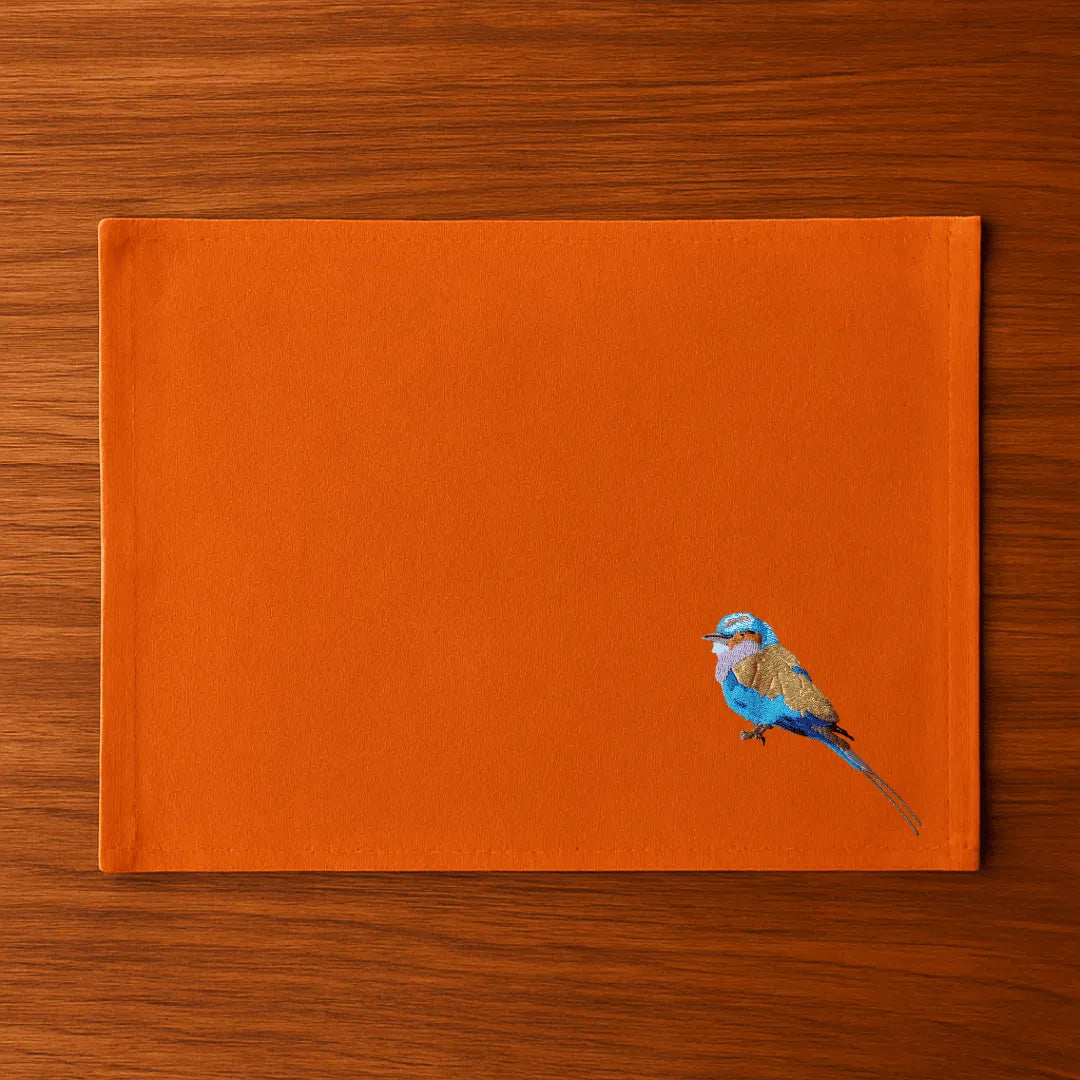 Handmade Ilisah table mats featuring lilac-breasted roller embroidery, set of 4 in mustard, perfect for dining and table d...