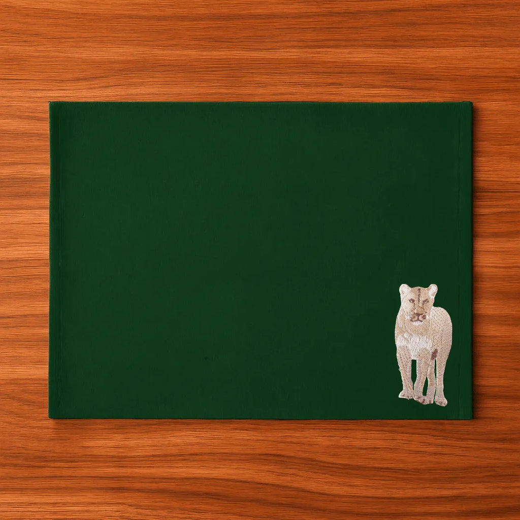 Handmade Ilisah Lion Embroidery table mats in mustard, set of 4, 100% cotton canvas, perfect for stylish dining decor.