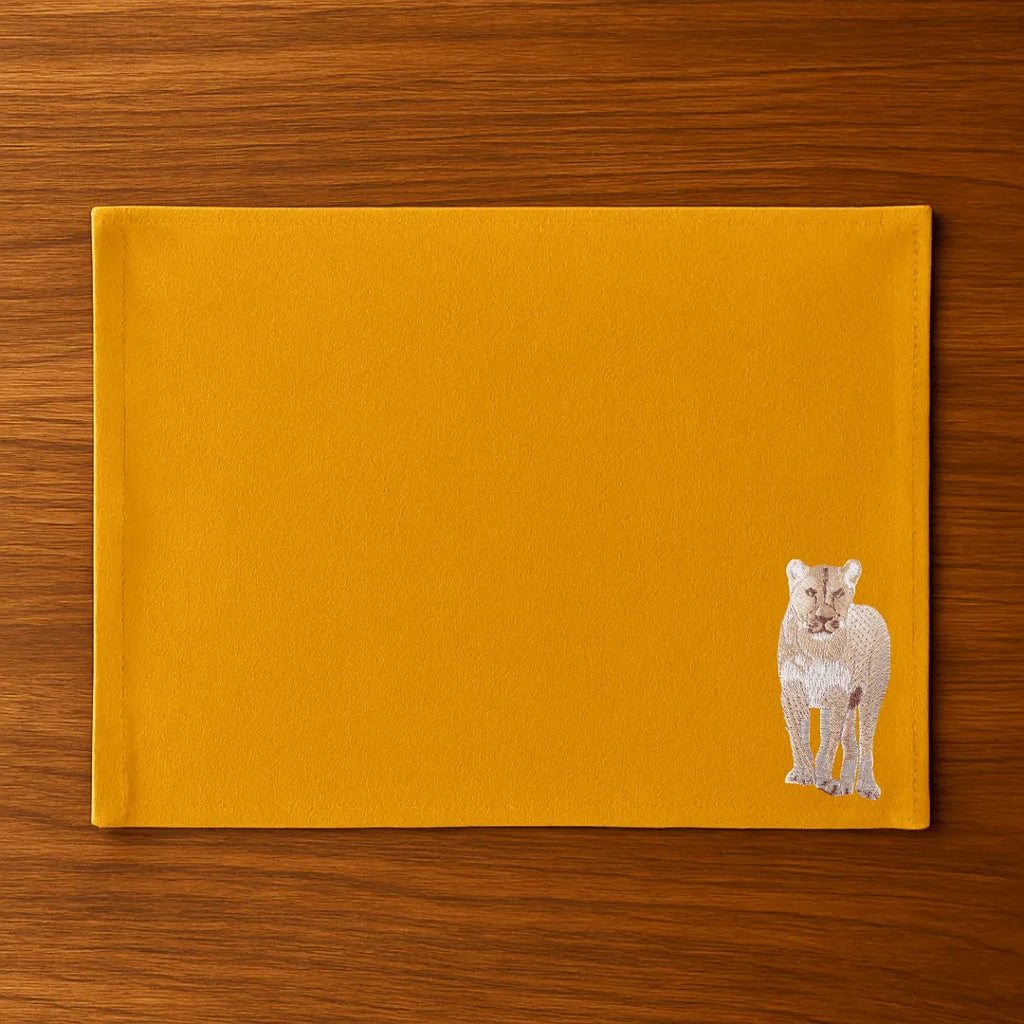 Handmade Ilisah Lion Embroidery table mats in mustard, set of 4, 100% cotton canvas, perfect for stylish dining decor.