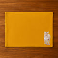 Handmade Ilisah Lion Embroidery table mats in mustard, set of 4, 100% cotton canvas, perfect for stylish dining decor.