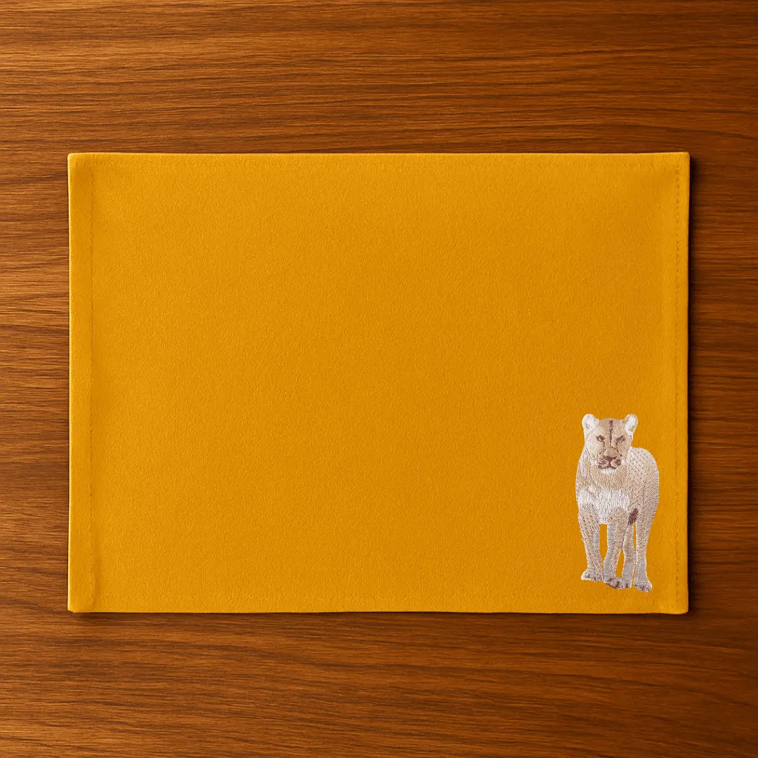 Handmade Ilisah Lion Embroidery table mats in mustard, set of 4, 100% cotton canvas, perfect for stylish dining decor.
