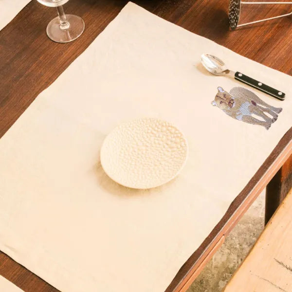 Handmade Ilisah Lion Embroidery table mats in mustard, set of 4, 100% cotton canvas, perfect for stylish dining decor.