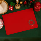 Red Christmas Table Mats by Ilisah, featuring a festive wreath motif, set of 4, handcrafted from cotton canvas for elegant...