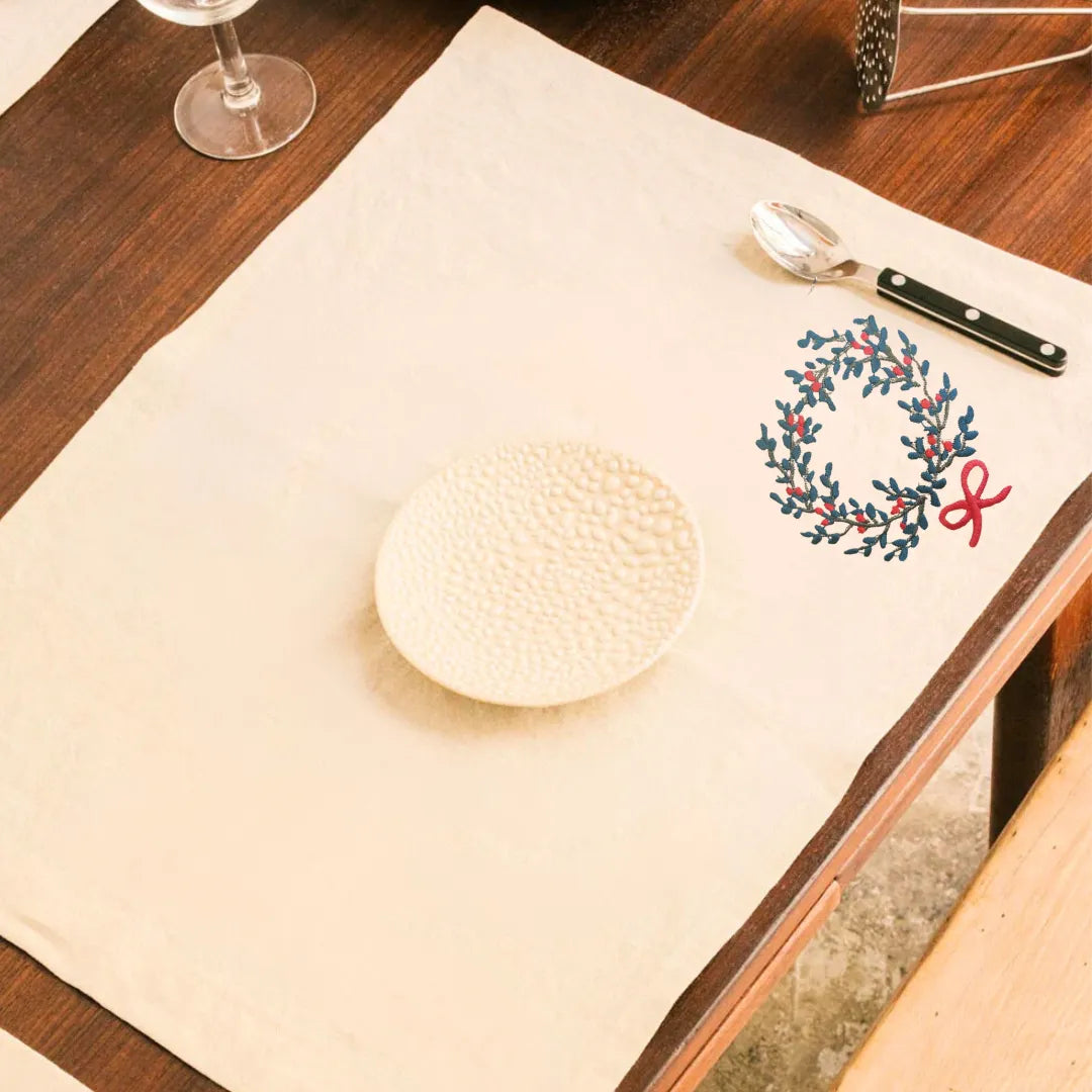 Red Christmas Table Mats by Ilisah, featuring a festive wreath motif, set of 4, handcrafted from cotton canvas for elegant...