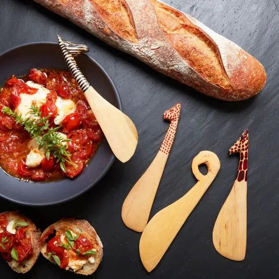 Wood Safari Animals Spreader Set by ILISAH, featuring four unique hand-carved wooden animal spreaders, each 7 inches long.